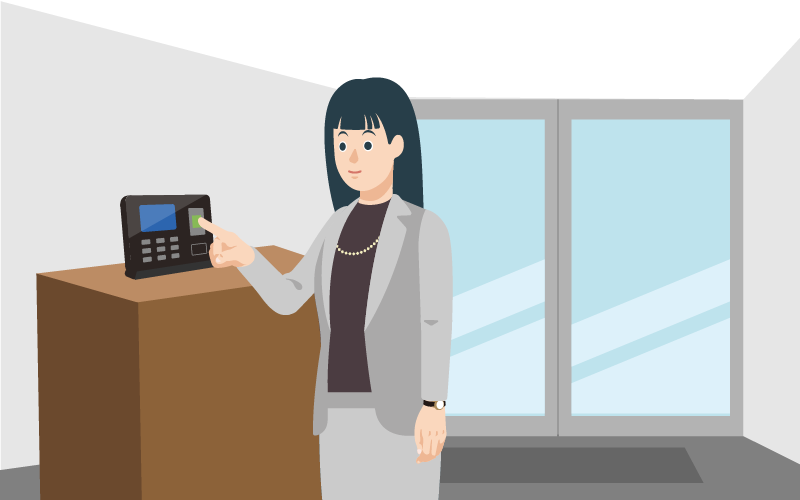 タイムレコーダーで指紋認証をしている先生